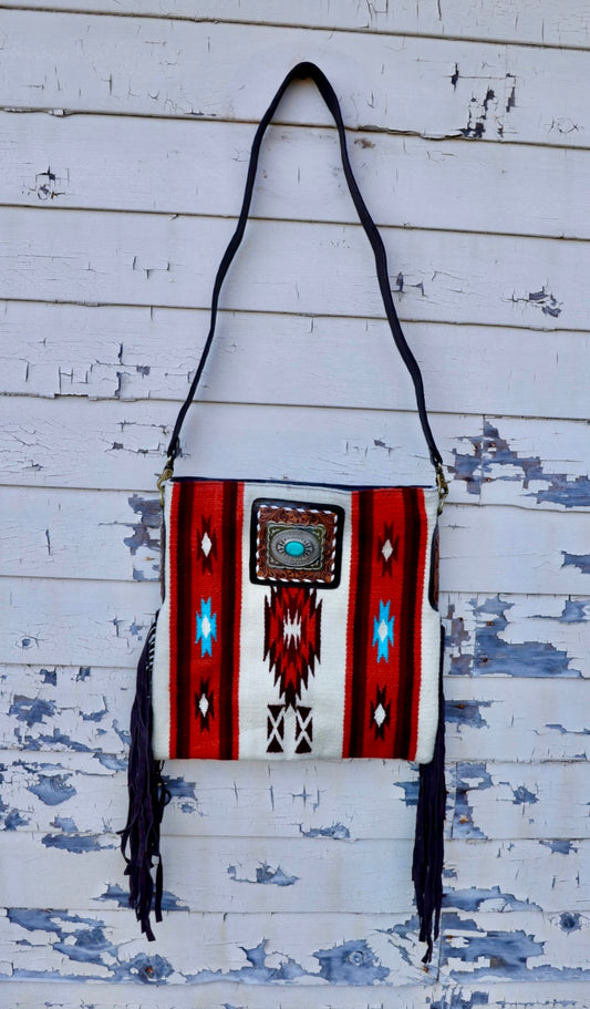 saddle blanket bag with side fridge and turquoise stone.