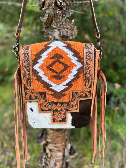 Saddle blanket and hair on hide bag with side fringe 